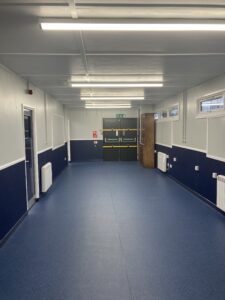 Main internal room with works completed. looking brand new with a blue and white decor.