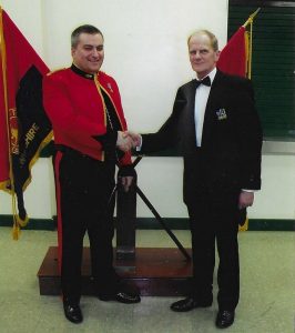 Company Commander handover in 2003 - two people shaking hands.