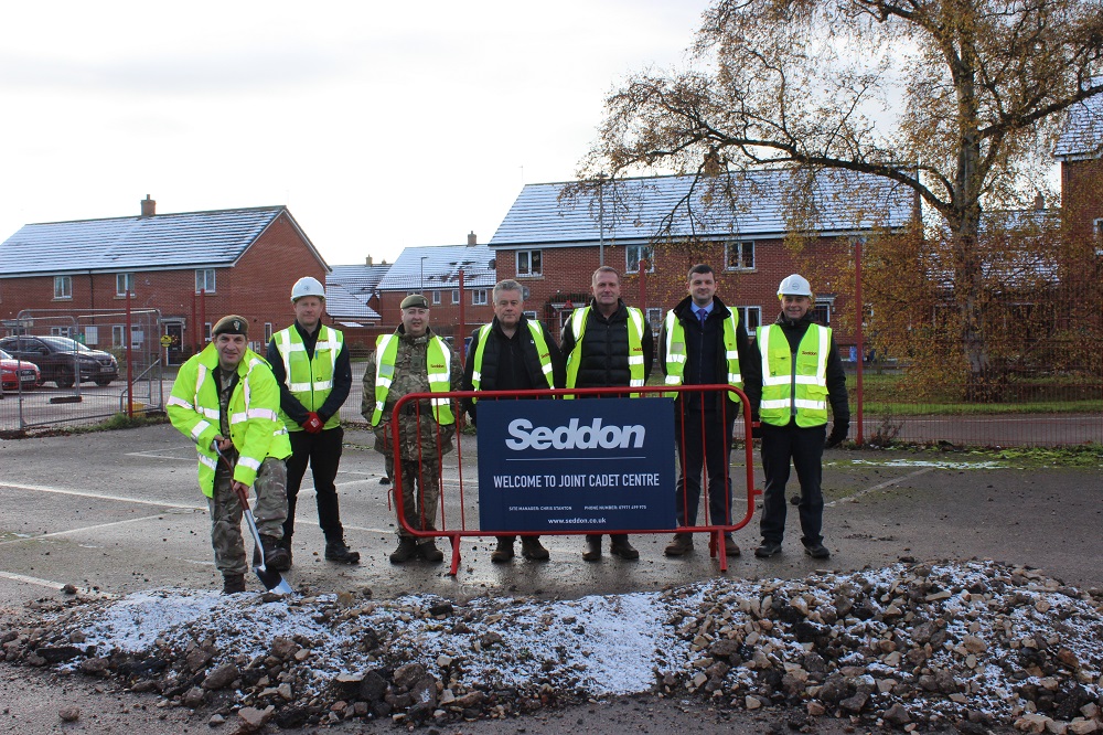 West Midland RFCA, Staffordshire & West Midlands (North Sector) Army Cadet Force and Seddon Construction Ltd pose for ground breaking with ceremonial spade.